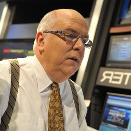 Tom Skilling in a white shirt caught on the camera.